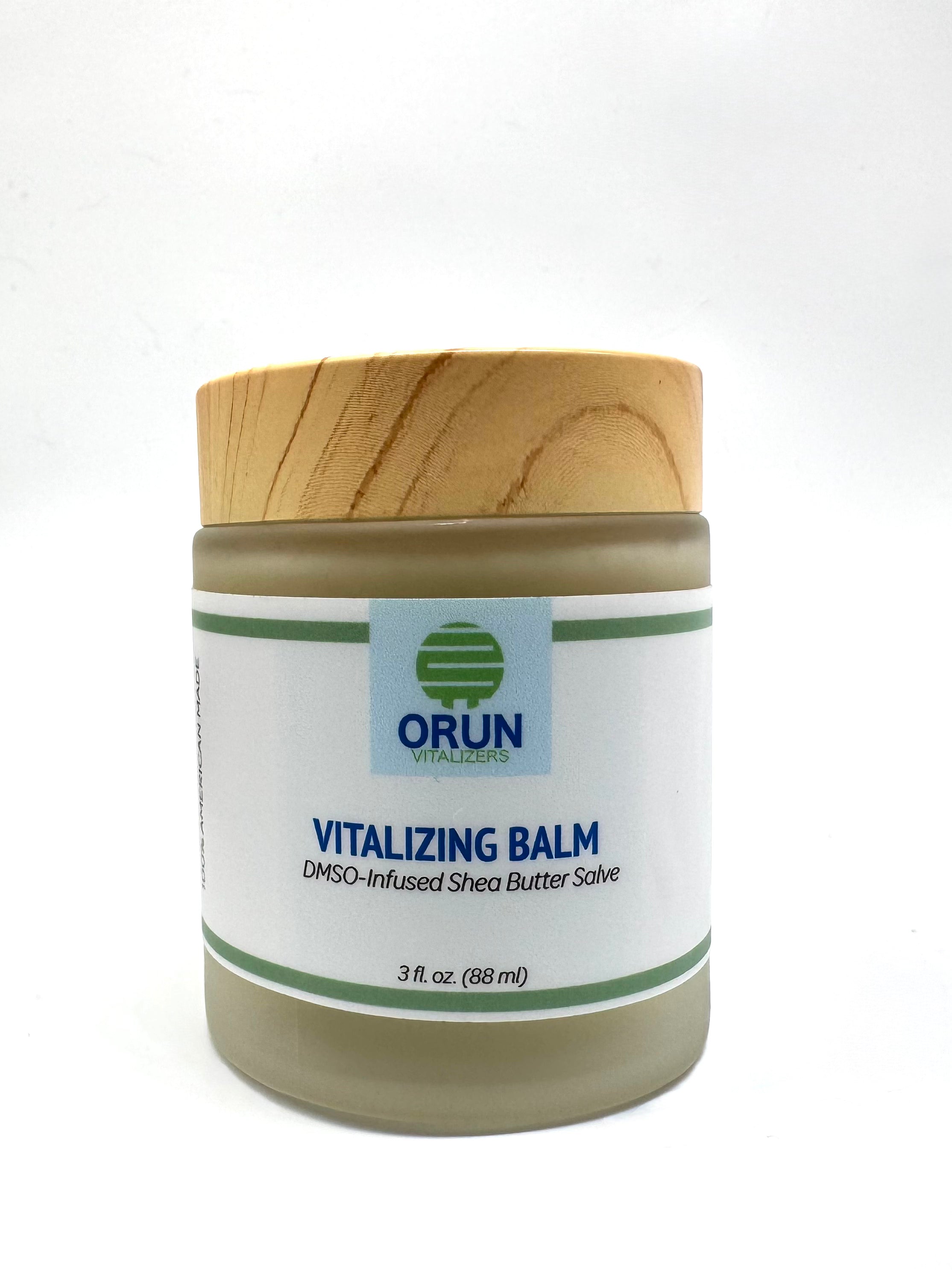 Jar of Orun Vitalizing Balm with a wooden lid on a white background